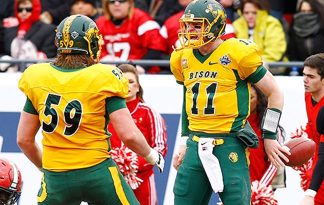 Haeg (59) started on four national championship teams at NDSU, the final two of which had Carson Wentz (right) under center.